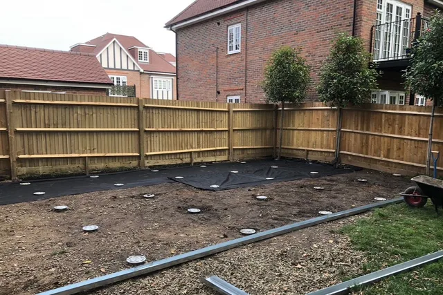 A measured arrangement of ground screw heads ready to receive the foundation layout.